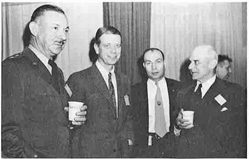 Furney, Keirn, McCormack, and Doolittle during a coffee break in briefing session